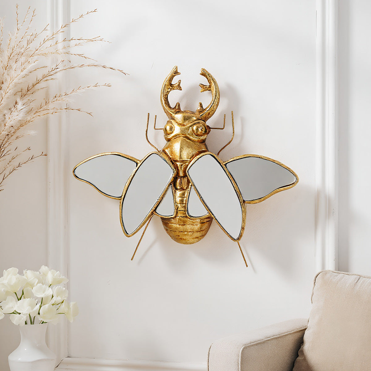 Mirror wall decoration with winged beetle