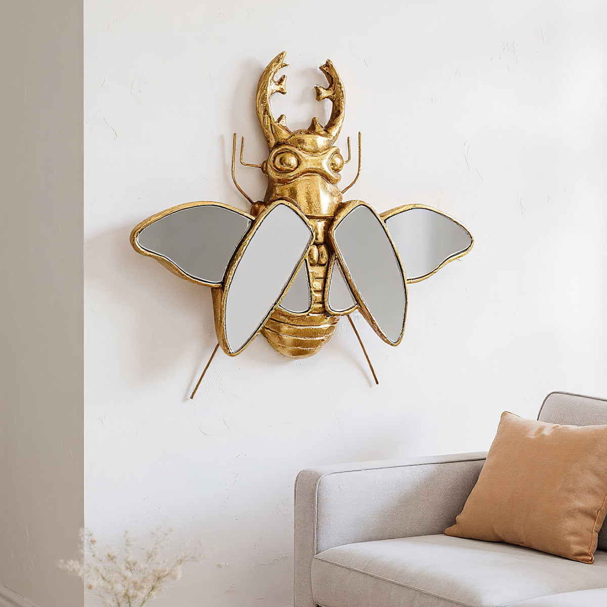 Mirror wall decoration with winged beetle